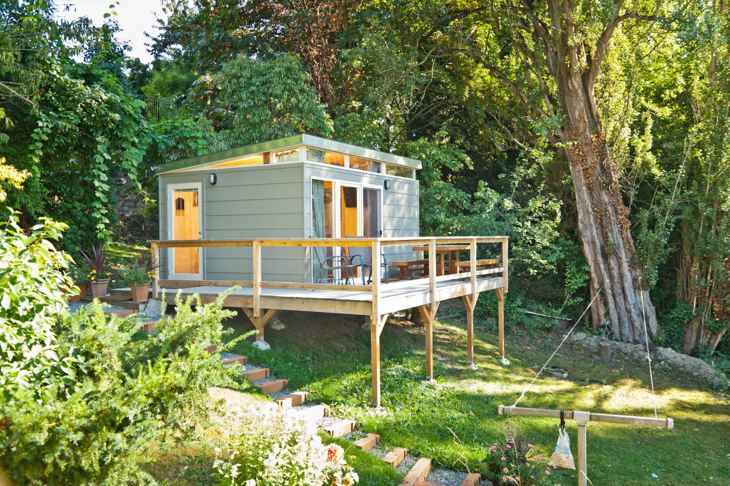 Elevated backyard shed with deck and garden setting